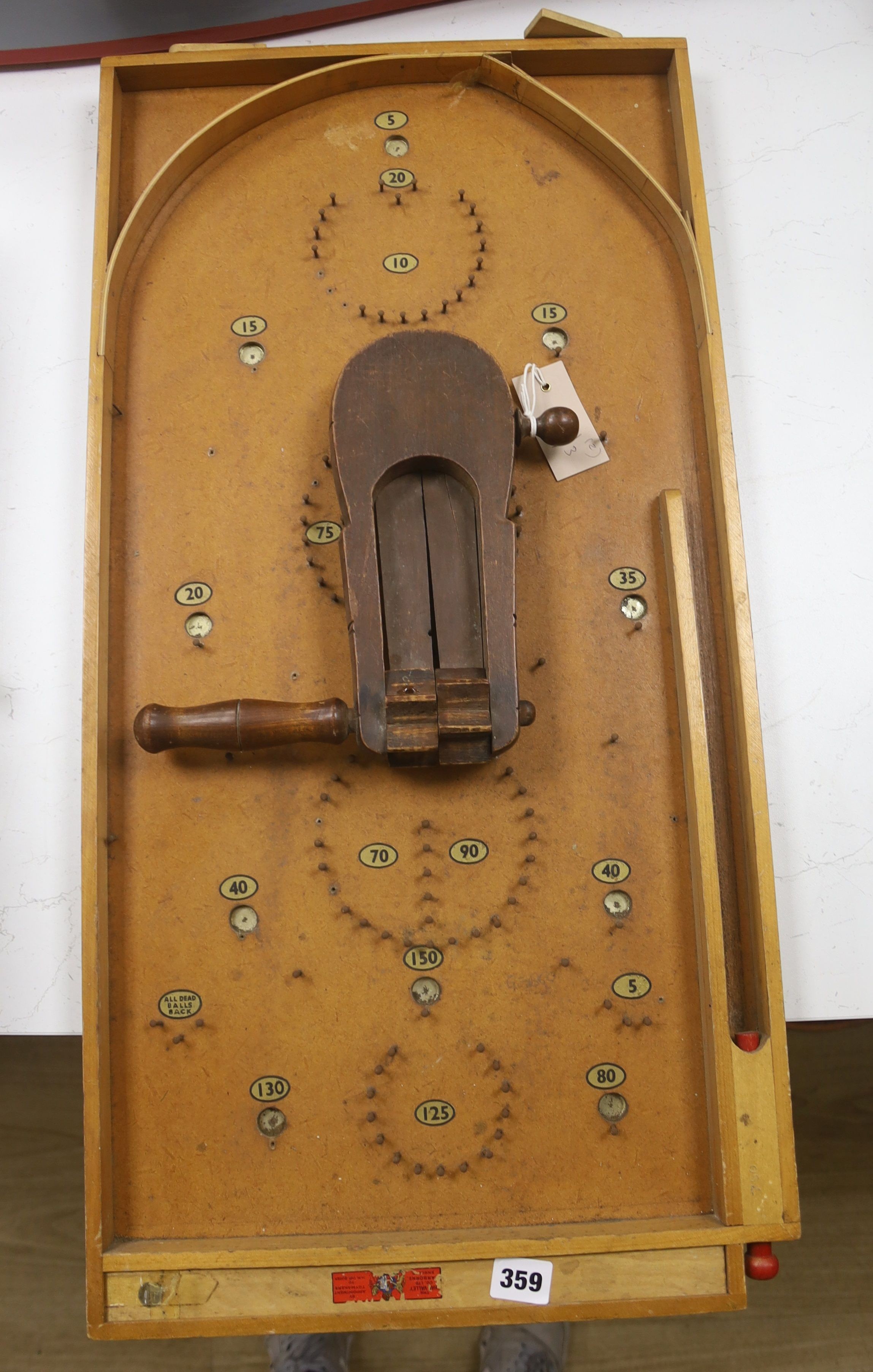 A vintage bird scarer and a Chad Valley bagatelle board